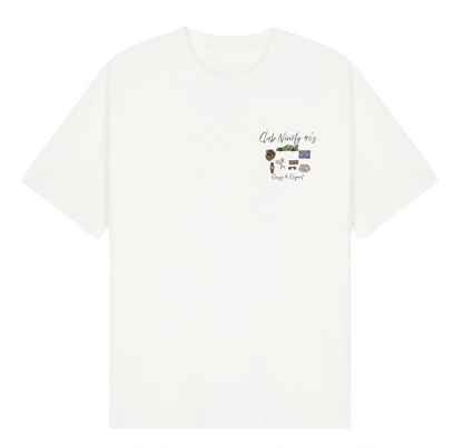 A white short-sleeve t-shirt with a small graphic on the left chest featuring a guitar, headphones, and the text 'Club Ninety' and 'Hang Daze!'. The image includes promotional text overlays from 'THE GALLERY DROP' and 'CLUB NINETY'.